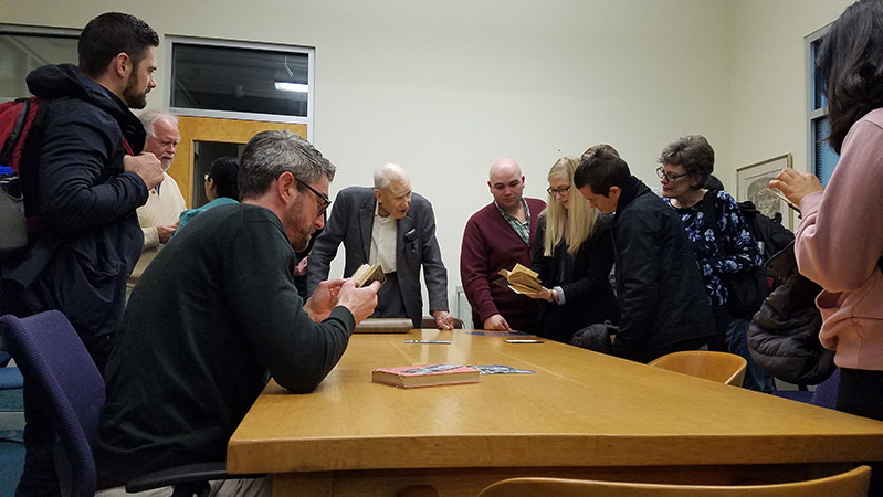 J.I. Packer with students in Rare Book Room